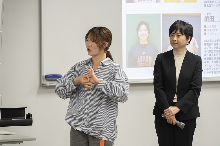 Photo: A student asking questions using sign language