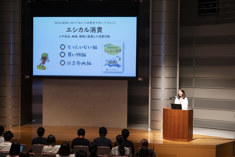 Photo 1: An advisor giving a keynote speech