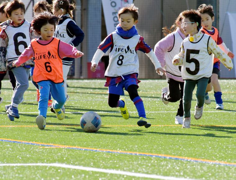 Photo: Participants chasing the ball