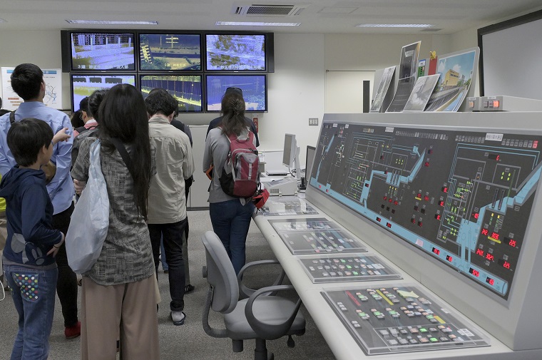 Photo: Participants visiting a room with a central monitoring control panel