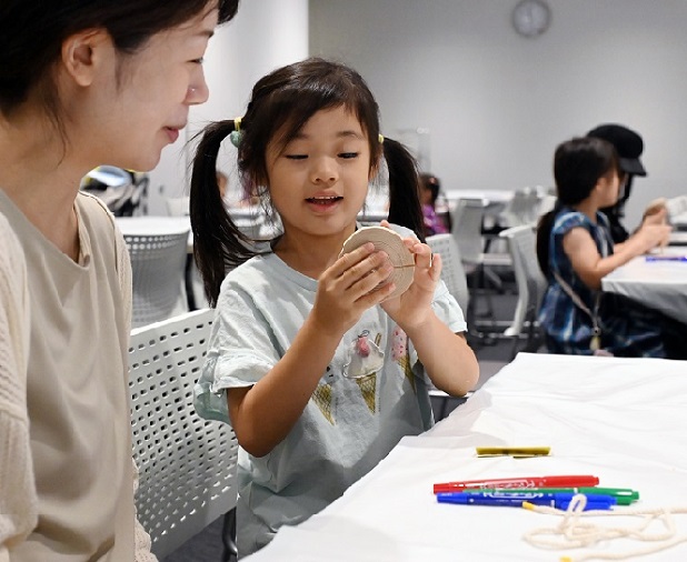 Participants making button spinners